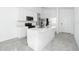 Modern kitchen featuring an island and stainless steel appliances at 4224 Pebbles Throw Dr, Kissimmee, FL 34746