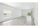 A bright living room with tile floors and sliding glass doors leading to the outdoor area at 4224 Pebbles Throw Dr, Kissimmee, FL 34746