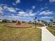 Community playground features climbing structures and a wood chip ground cover, with a sidewalk leading to the pool at 4224 Pebbles Throw Dr, Kissimmee, FL 34746