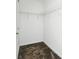 A functional walk-in closet featuring neutral carpet and wire shelving for organized storage at 4224 Pebbles Throw Dr, Kissimmee, FL 34746