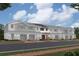 Charming townhome exterior featuring a two-car garage at 4279 Campsite Loop, Orlando, FL 32824
