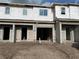 New construction townhome with concrete blocks, a garage, and ready for customization to make it a dream home at 4279 Campsite Loop, Orlando, FL 32824