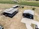 View of outdoor storage facilities with carports, workshop with metal roof at 4400 Walker Lake Rd, Bartow, FL 33830