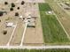 Aerial view of ranch property featuring a home, open green space, and green crops along the property lines at 4400 Walker Lake Rd, Bartow, FL 33830