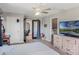Open bedroom features a light color palette, tv, and private bathroom at 4400 Walker Lake Rd, Bartow, FL 33830