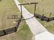 Long driveway leading to the house with decorative cattle horns, wheel and chicken ornament at 4400 Walker Lake Rd, Bartow, FL 33830