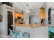 Well-lit kitchen features light wood cabinets, breakfast bar, and modern appliances at 4400 Walker Lake Rd, Bartow, FL 33830