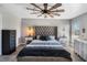 Spacious main bedroom with plush carpeting, designer ceiling fan, and ample natural light at 4400 Walker Lake Rd, Bartow, FL 33830