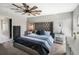 Comfortable main bedroom featuring an elegant bed, soft carpet, and plenty of natural light from a nearby window at 4400 Walker Lake Rd, Bartow, FL 33830