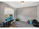 Spacious playroom featuring a gray rug, natural light, and various colorful toys at 4400 Walker Lake Rd, Bartow, FL 33830