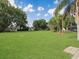 Expansive backyard featuring lush green grass and mature trees at 51 Park Ln, Debary, FL 32713