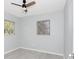 This bedroom offers a light and airy atmosphere with natural light and tile floors at 51 Park Ln, Debary, FL 32713
