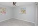 This bedroom offers a light and airy atmosphere with natural light and tile floors at 51 Park Ln, Debary, FL 32713