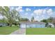 Charming single-story home with a well-manicured lawn and classic blue color scheme at 51 Park Ln, Debary, FL 32713