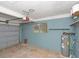 Spacious garage with gray cinder block walls, overhead door, and an electric garage door opener at 51 Park Ln, Debary, FL 32713