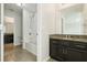 Bathroom showcasing a dark vanity with granite countertop and a separate tub and shower at 611 Marsh Reed Dr, Winter Garden, FL 34787