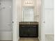 Bathroom featuring a dark vanity with a granite countertop and a shower/tub combo at 611 Marsh Reed Dr, Winter Garden, FL 34787