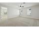 Neutral bedroom with carpet flooring, ample natural light, and views to the exterior of the home at 611 Marsh Reed Dr, Winter Garden, FL 34787