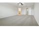 Bedroom featuring neutral carpet, white walls, ceiling fan, and doors to other rooms at 611 Marsh Reed Dr, Winter Garden, FL 34787