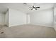Large, open bedroom with carpet floors, a ceiling fan, neutral walls, and a window letting in natural light at 611 Marsh Reed Dr, Winter Garden, FL 34787