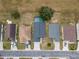 An aerial view features a pool, well-spaced houses, and orderly street layout at 721 Rollins Dr, Davenport, FL 33837