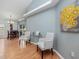 Bright living room showcasing vaulted ceilings, natural light, and decorative wall art at 721 Rollins Dr, Davenport, FL 33837