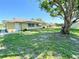 The backyard features mature trees, a shed, and plenty of space at 760 Eastridge Dr, Orange City, FL 32763
