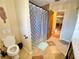 Bathroom with tiled floors, a shower, and a toilet creating a functional and clean space at 760 Eastridge Dr, Orange City, FL 32763