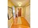 Inviting hallway with hardwood floors and closet space at 760 Eastridge Dr, Orange City, FL 32763