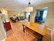 Spacious living room featuring a dining table, comfortable seating, and an open layout for versatile living at 760 Eastridge Dr, Orange City, FL 32763