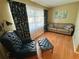 Comfortable living room featuring a stylish chair and couch set, perfect for relaxing and entertaining guests at 760 Eastridge Dr, Orange City, FL 32763