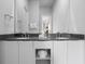 Bathroom featuring a double sink vanity with elegant countertops and fixtures at 7770 Sandy Ridge Dr # 207, Reunion, FL 34747