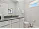 Clean half-bath with modern vanity, sleek fixtures, and minimalist décor at 7770 Sandy Ridge Dr # 207, Reunion, FL 34747