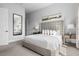 Cozy bedroom with neutral tones, plush headboard, and ample natural light at 7770 Sandy Ridge Dr # 207, Reunion, FL 34747
