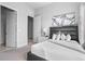 Inviting bedroom with a plush bed, stylish artwork, and ample natural light at 7770 Sandy Ridge Dr # 207, Reunion, FL 34747