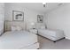 Bright and airy bedroom with two twin beds, neutral decor, and stylish bedside tables at 7770 Sandy Ridge Dr # 207, Reunion, FL 34747