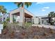 The modern building exterior is enhanced by well-kept landscaping and a convenient roundabout at 7770 Sandy Ridge Dr # 207, Reunion, FL 34747