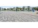A lagoon style pool is surrounded by lounge seating and palm trees in this community at 7770 Sandy Ridge Dr # 207, Reunion, FL 34747