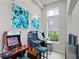 Fun-filled game room featuring three arcade games, stools, and natural light from the window at 7770 Sandy Ridge Dr # 207, Reunion, FL 34747