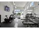 Spacious fitness center equipped with treadmills, bikes, weights, and mirrored wall at 7770 Sandy Ridge Dr # 207, Reunion, FL 34747