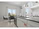 Bright kitchen island with stainless steel dishwasher and views from surrounding windows at 7770 Sandy Ridge Dr # 207, Reunion, FL 34747