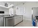 Contemporary kitchen island with stainless steel appliances and modern pendant lighting at 7770 Sandy Ridge Dr # 207, Reunion, FL 34747