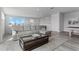 Comfortable living room featuring a plush sofa, glass coffee table, and neutral decor at 7770 Sandy Ridge Dr # 207, Reunion, FL 34747