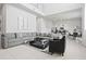Bright and spacious living area features soaring ceilings, an expansive gray sofa, and contemporary decor at 7770 Sandy Ridge Dr # 207, Reunion, FL 34747