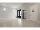 Lobby area featuring tile floors, double doors, an elevator, and exit signs that provide a welcoming and safe entry at 7770 Sandy Ridge Dr # 207, Reunion, FL 34747