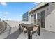 This rooftop patio includes outdoor dining and space for relaxation in a modern setting at 7770 Sandy Ridge Dr # 207, Reunion, FL 34747