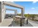 This patio has a dining table and multiple lounge chairs with views of the surrounding area at 7770 Sandy Ridge Dr # 207, Reunion, FL 34747