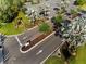 Aerial view of the lushly landscaped community streets with decorative palm trees and well manicured lawns at 7770 Sandy Ridge Dr # 207, Reunion, FL 34747