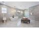 This luxury bathroom features marble floors and walls, free standing tub, and separate shower at 8125 Via Rosa, Orlando, FL 32836