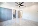 This large bedroom features light gray walls and marble floors, with attached bathroom and walk-in closet at 8125 Via Rosa, Orlando, FL 32836